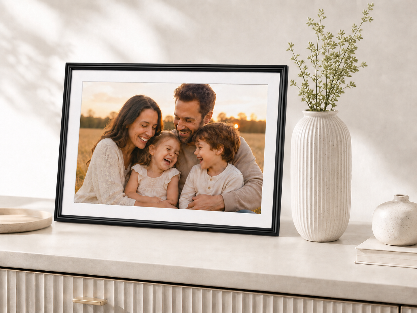 Elime WiFi digital picture frame on a wood console in a warm, modern living room